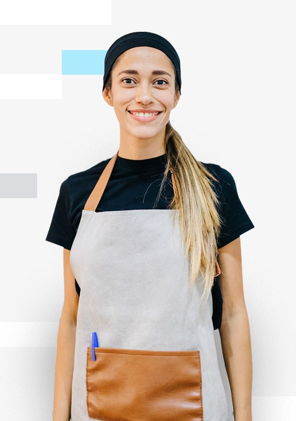 Lady with a black cap and apron smiling
